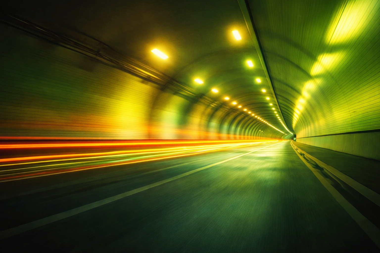 Light trails speeding through a tunnel